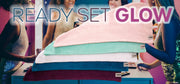 Glow Up Party theme from the turbie twist party pack: 5 cotton Turbie Twist towels in peach, turquoise, white, cobalt, and maroon, with five ladies in the background and 'Ready, set, glow' text in the foreground.